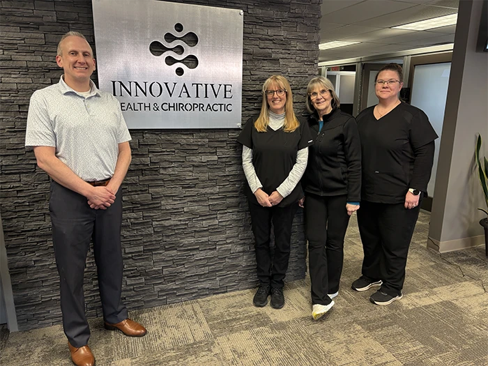 Chiropractor Grand Rapids MI Cory Wellman with team