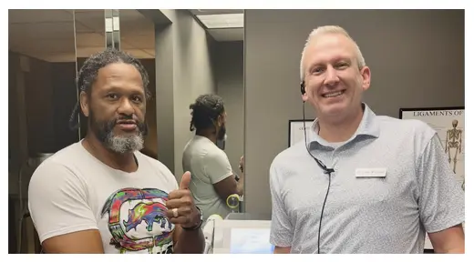Dr. Cory Wellman with a patient at Innovative Health & Chiropractic in Grand Rapids, Michigan